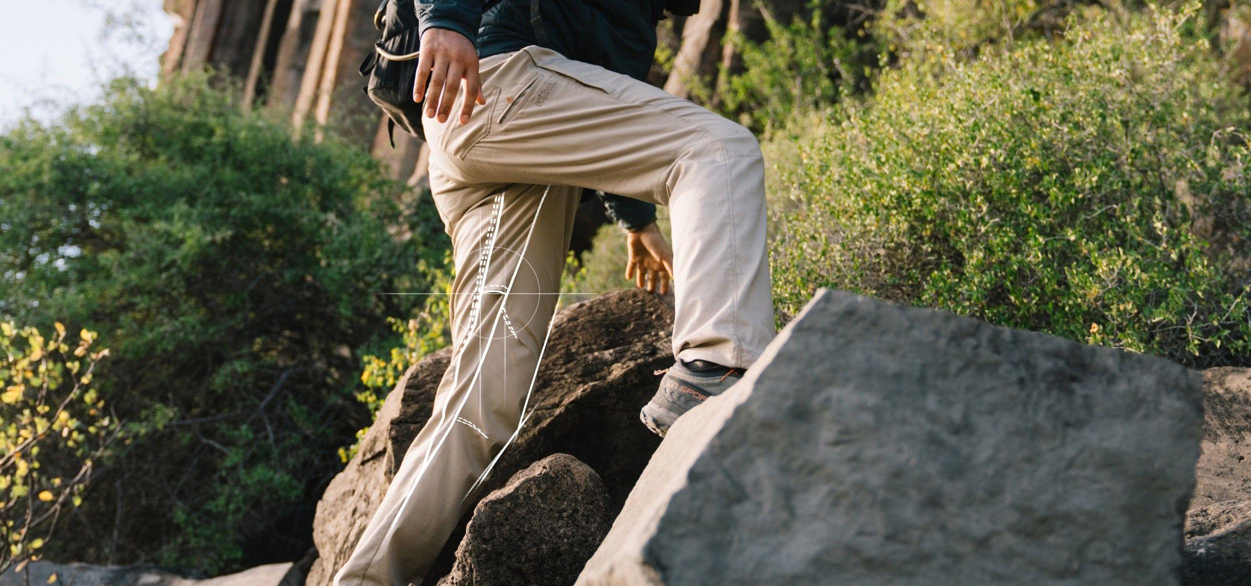 Man hiking in KUHL pants.