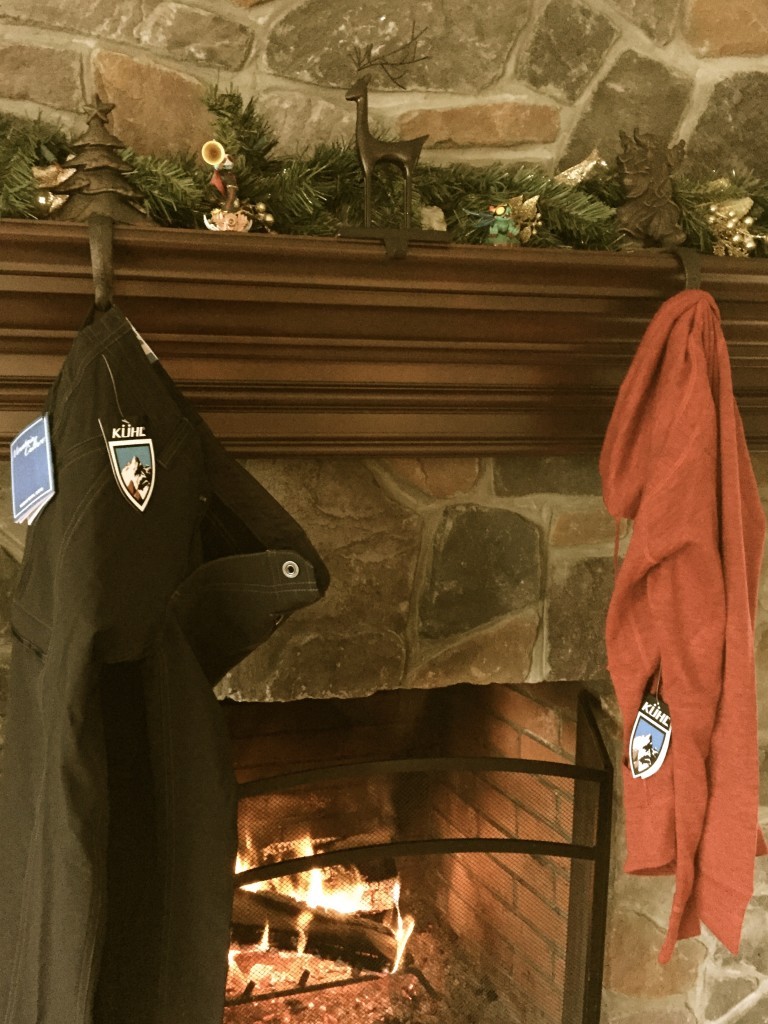 New Kuhl apparel hanging from the hearth