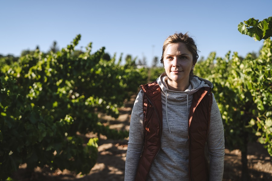 6 Ways to Salvage Your Summer - A woman dressed in KUHL clothing hiking in wine country
