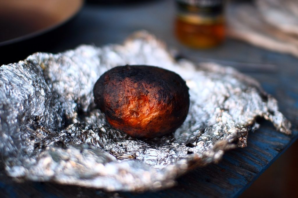 burned potato on tin foil