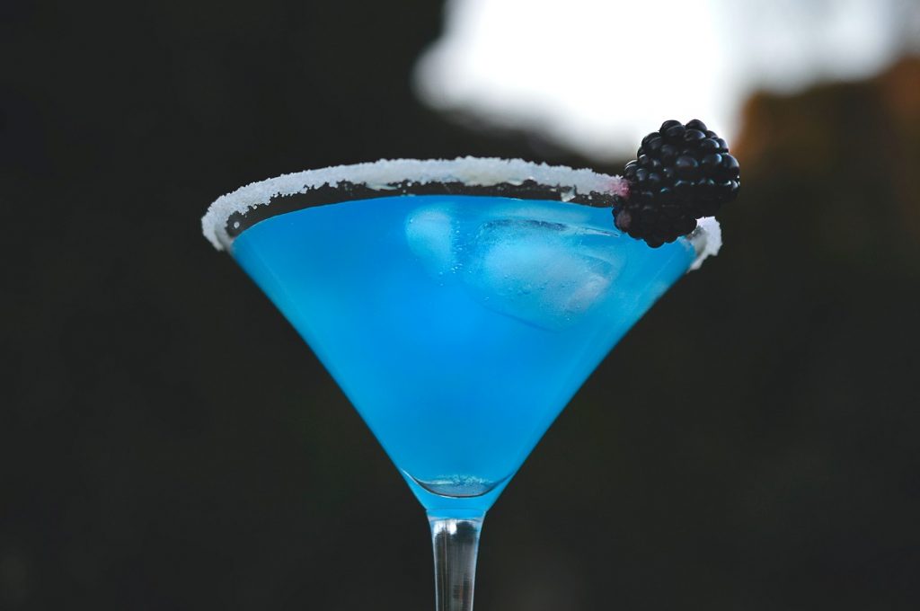 blue liquid in drinking glass