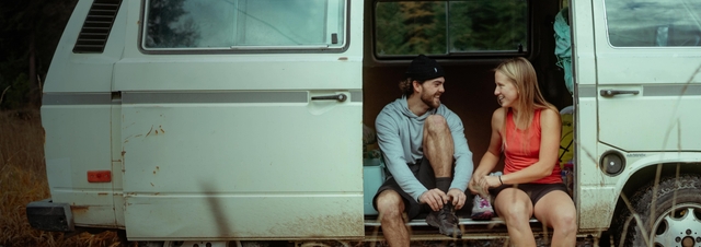 a group of friends on a porch wearing KÜHL clothing.