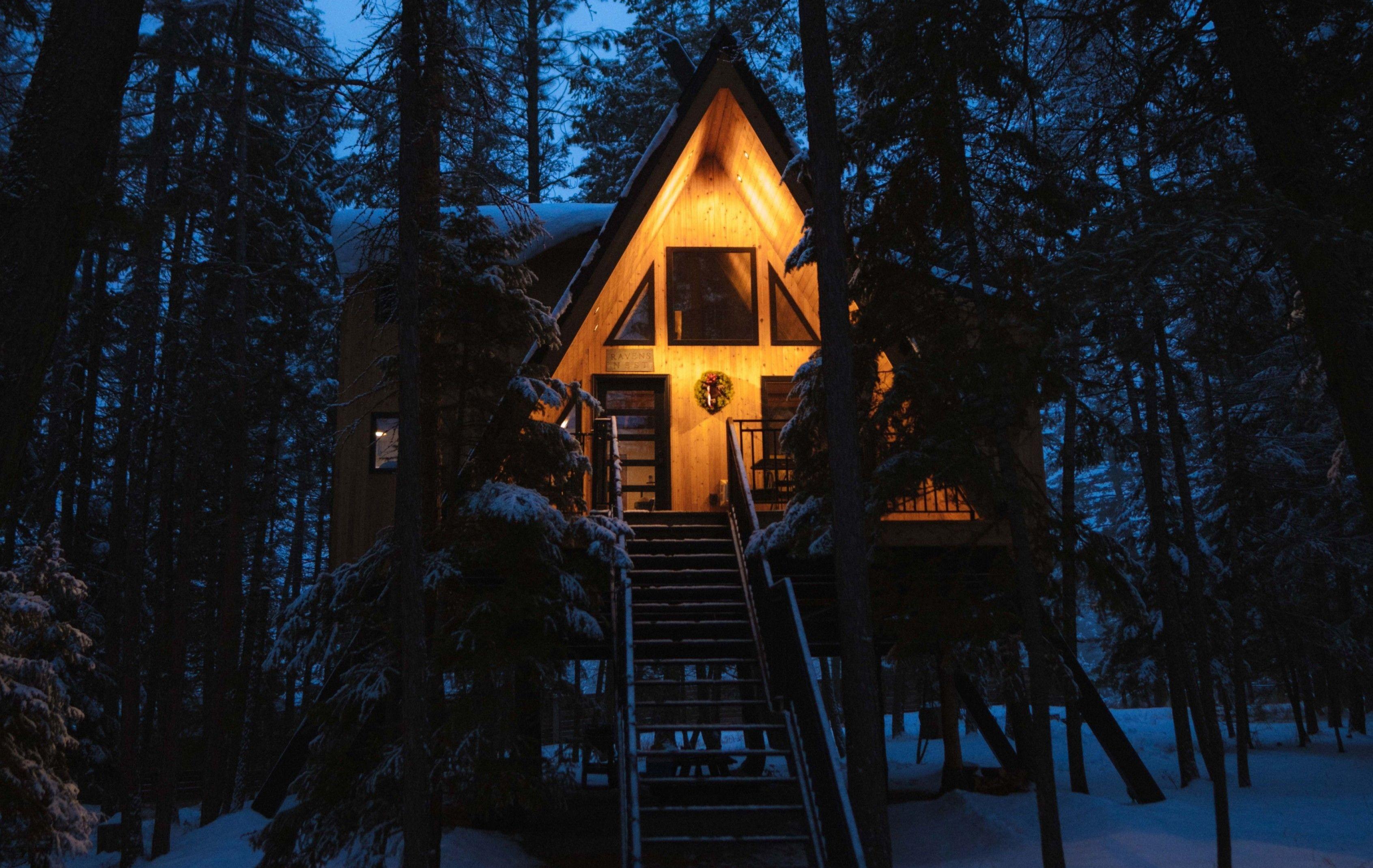 Kuhl gift guide with a scene of a cabin in the forest