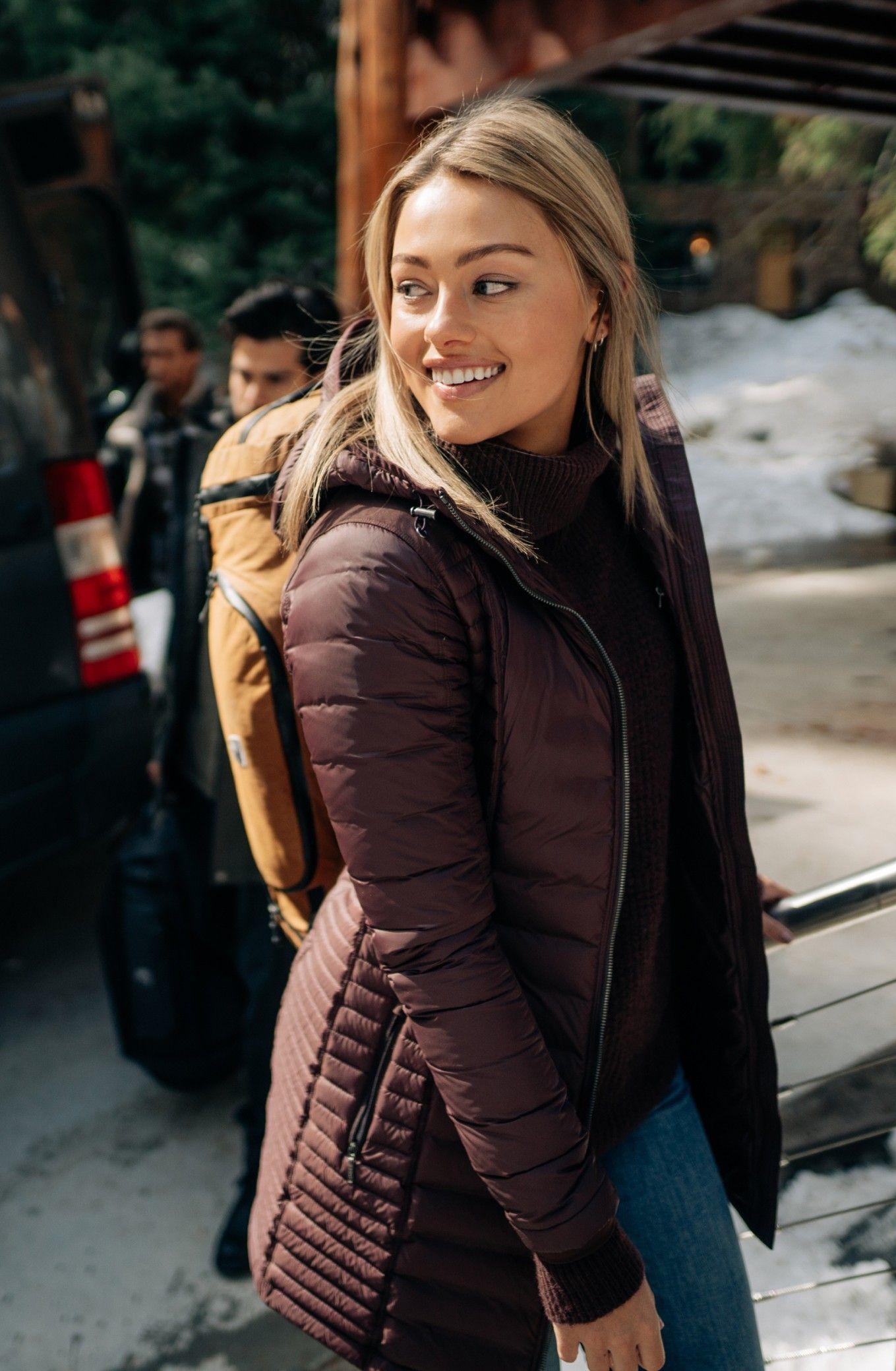 Woman wearing KUHL jacket and backpack