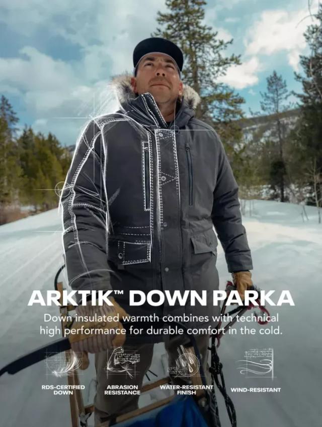 A man practicing sledding and using an Arktik Down Parka Jacket