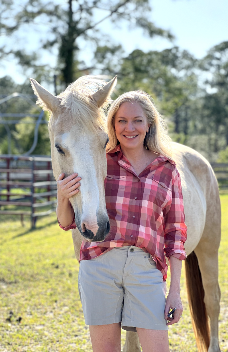  Laurie Hood and a horse at Alaqua Animal Refuge.