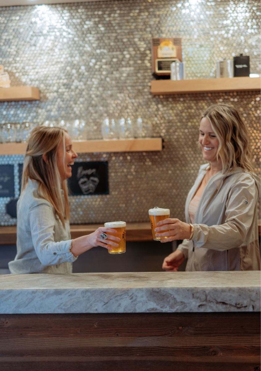 Two moms enjoying cold beer in Soul Ride Taproom