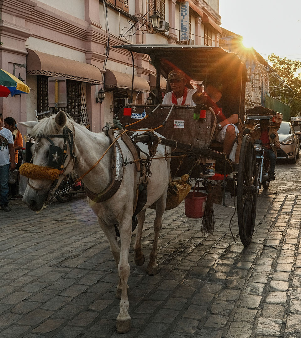 A beautiful carriage  on cobblestone street in Philippines 