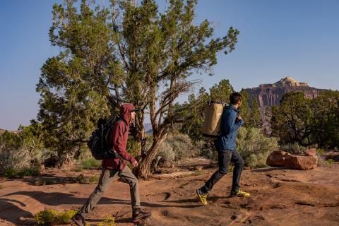 people hiking in a desert