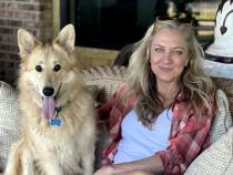 Laurie Hood and a dog at Alaqua Animal Refuge.