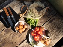 Elevated camping cooking ingredients on a wooden table