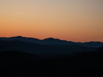 gravel biking with bob olden - a photo of a sunset over mountains