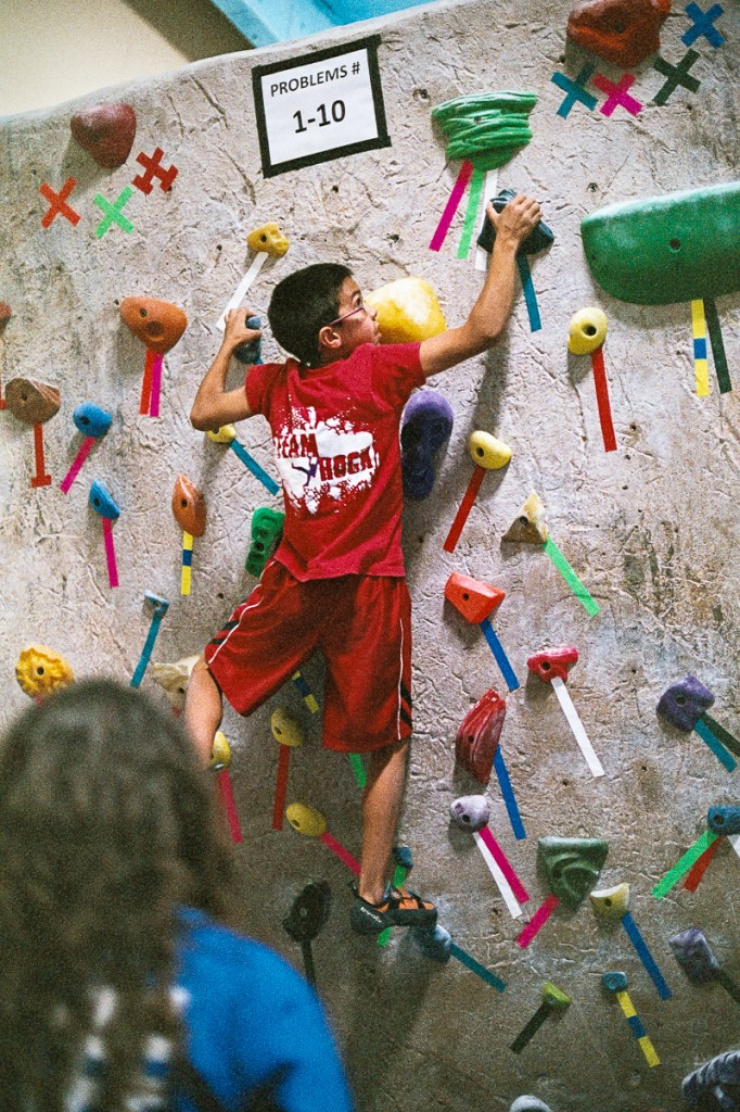 Caption: Climbers of all ages compete in a fair, fun, and intense local ABS 