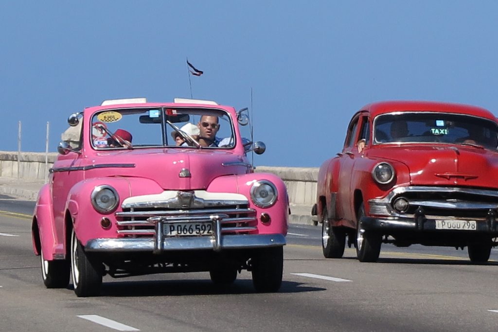 An image of a pink old timer still in use in Cuba
