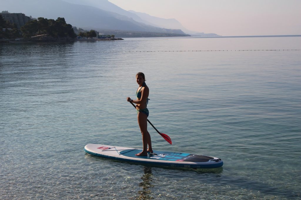 A woman paddling in Brela, Croatia.