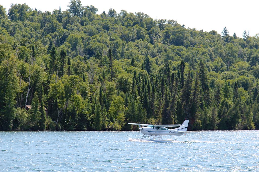 sea plane landing on lake