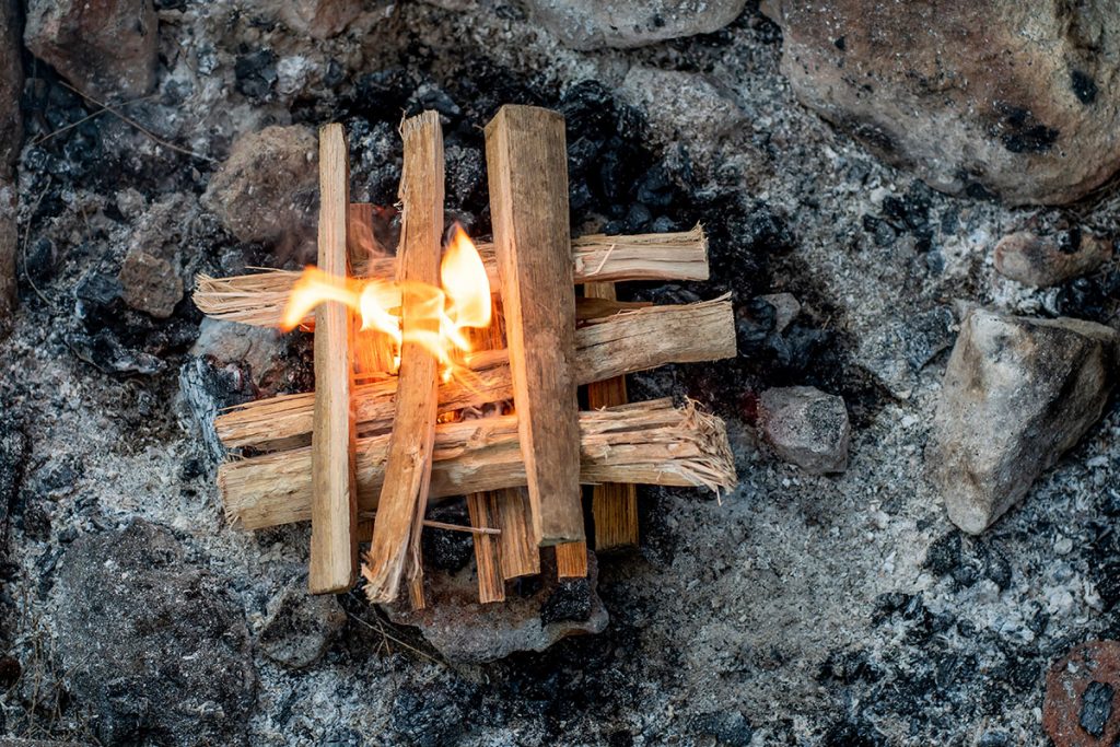 Starting the camp fire with kindling