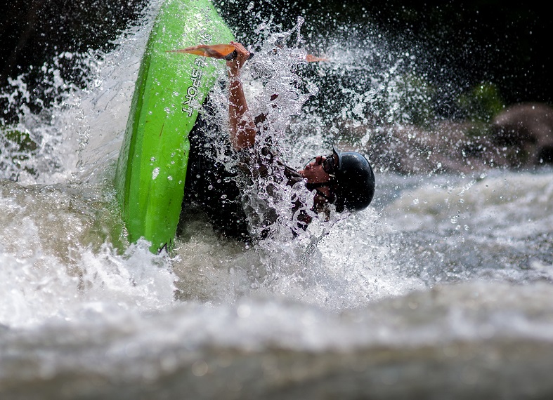 Whitewater Rafting 101 - A man falling in water.
