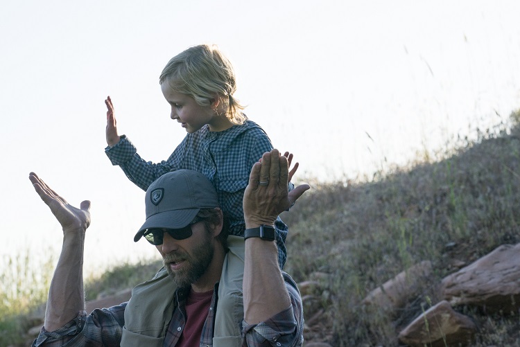 Camping Traditions 1 Camping Traditions - A father and his daughter sing a camping song and high-five