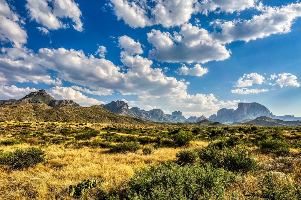 desert and mountains under blue sky