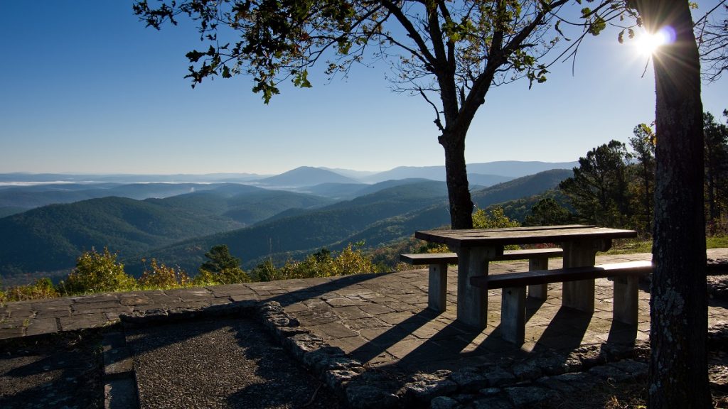 picnic tables on the overlook near mountains