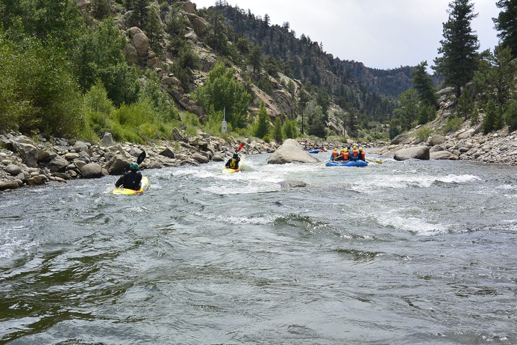 rafters and kayakers on the river