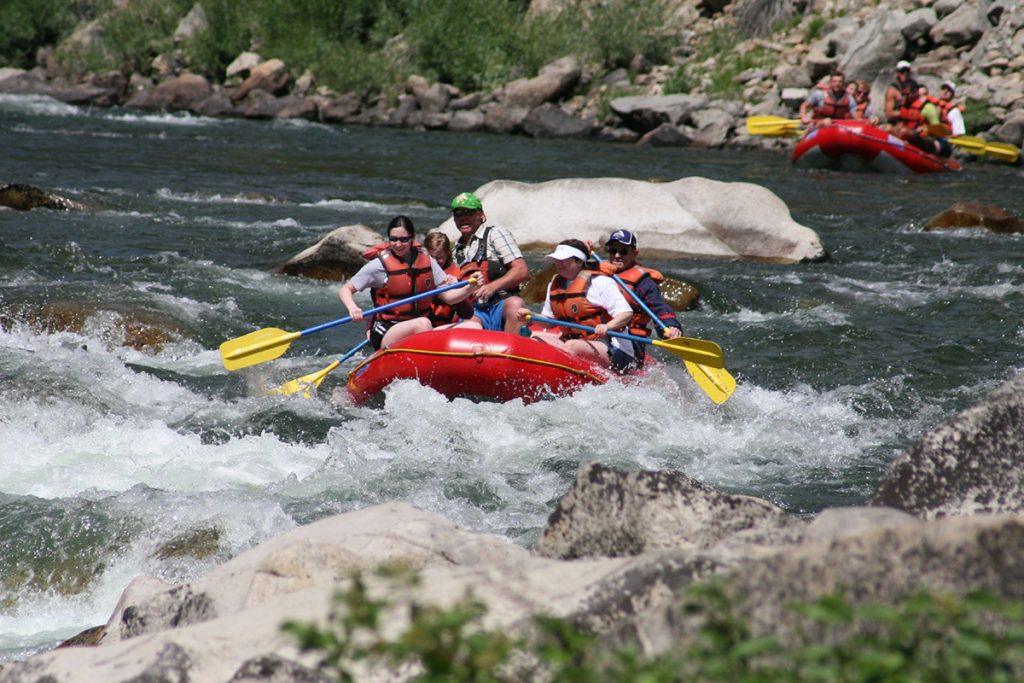 whitewater rafting in red raft on the river
