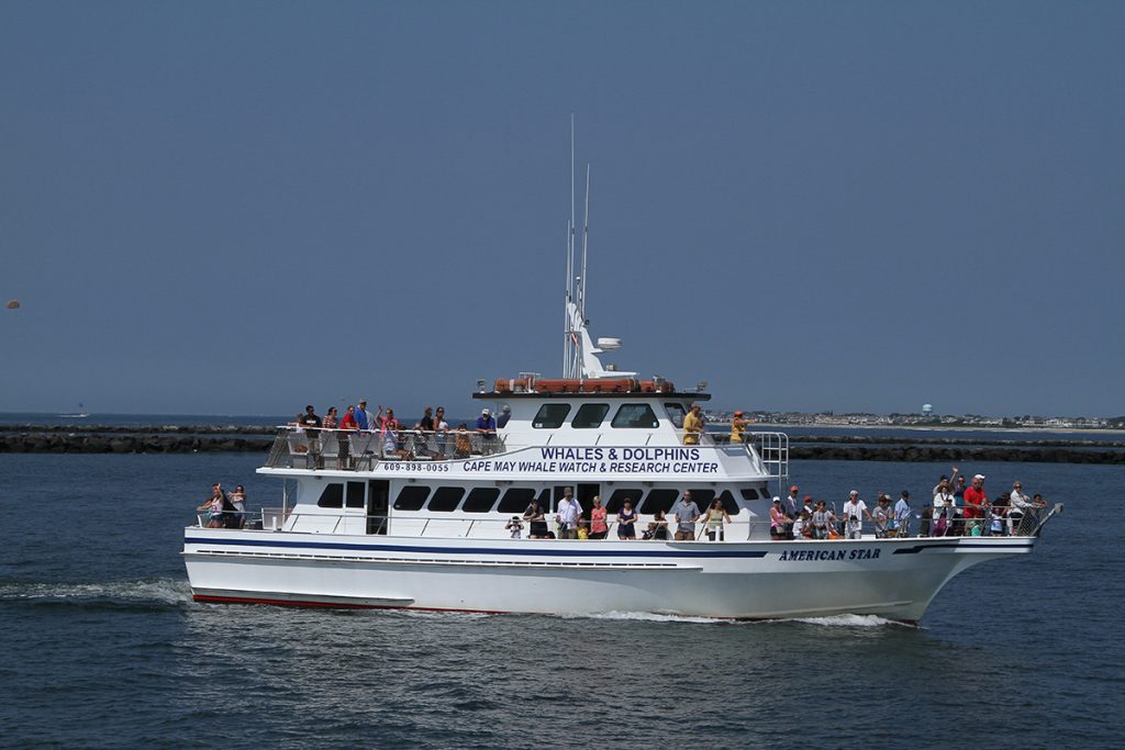 white boat with people on deck