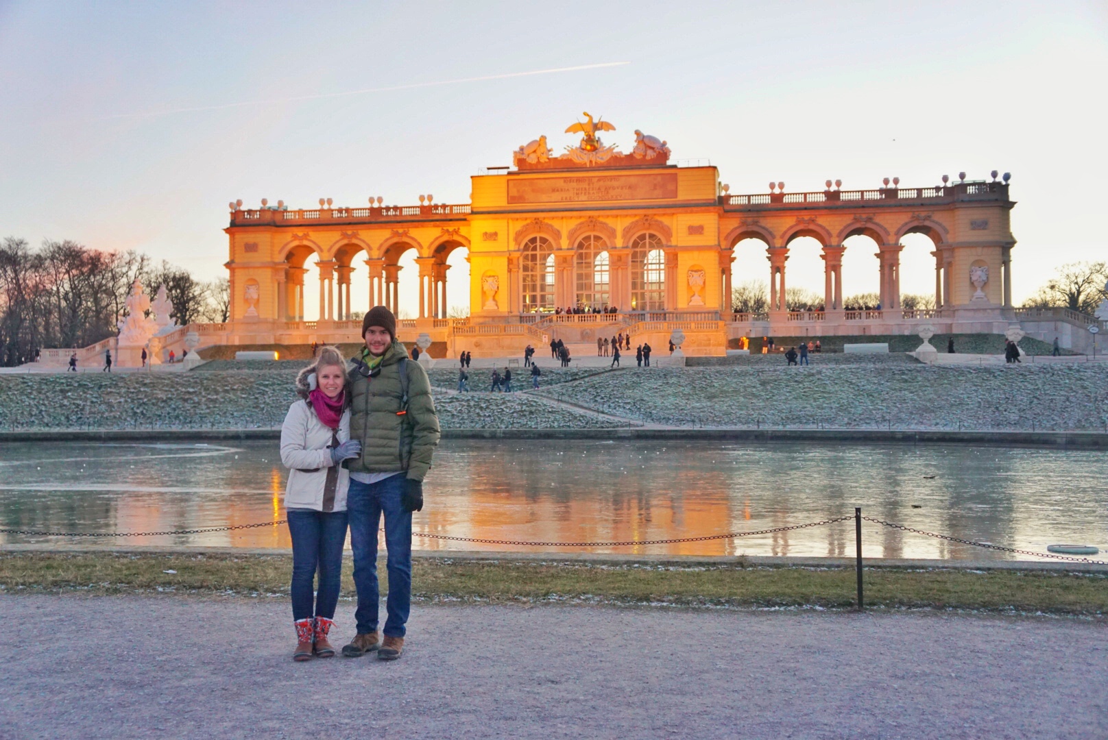 KUHL Ambassador Nicole with a KUHL man standing next to a historical landmark in Vienna.