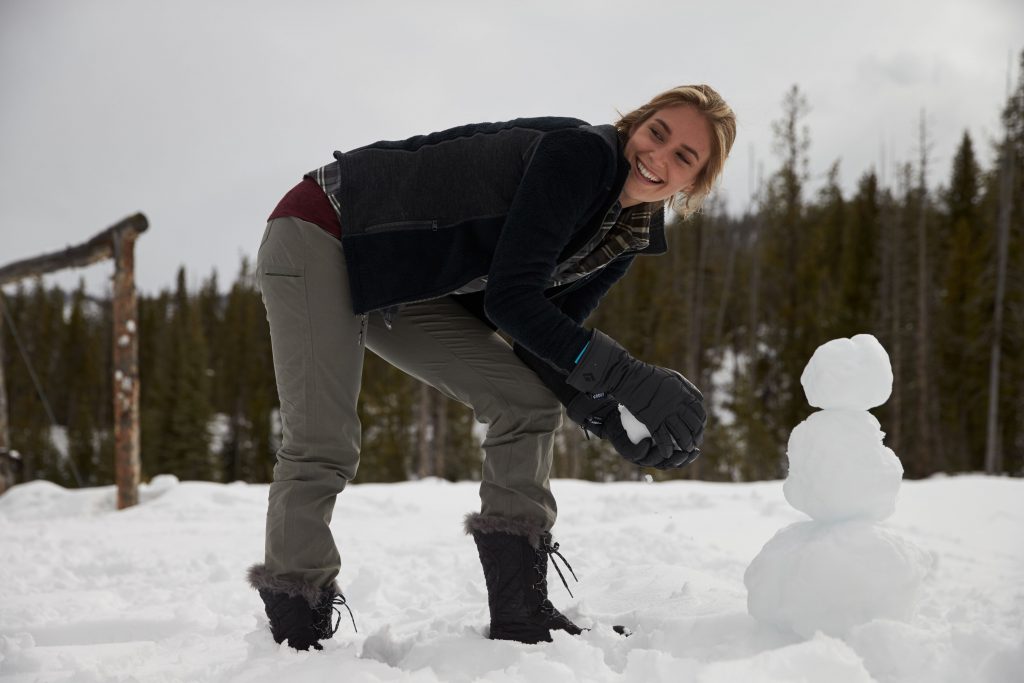The Magic of Snow: A woman making a snowman