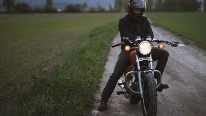 man with black helmet on motocycle
