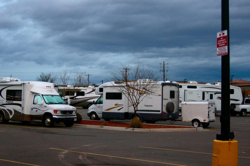 white RVs parked on walmart parking