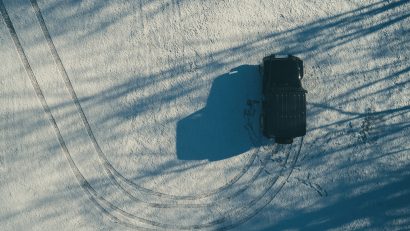 aerial photo of black jeep riding on snow