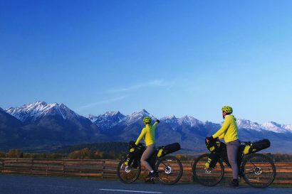 The man and woman travel on mixed terrain cycle touring with bikepacking