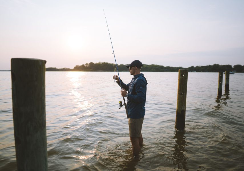 A man fishing in outdoor clothing on KUHL blog