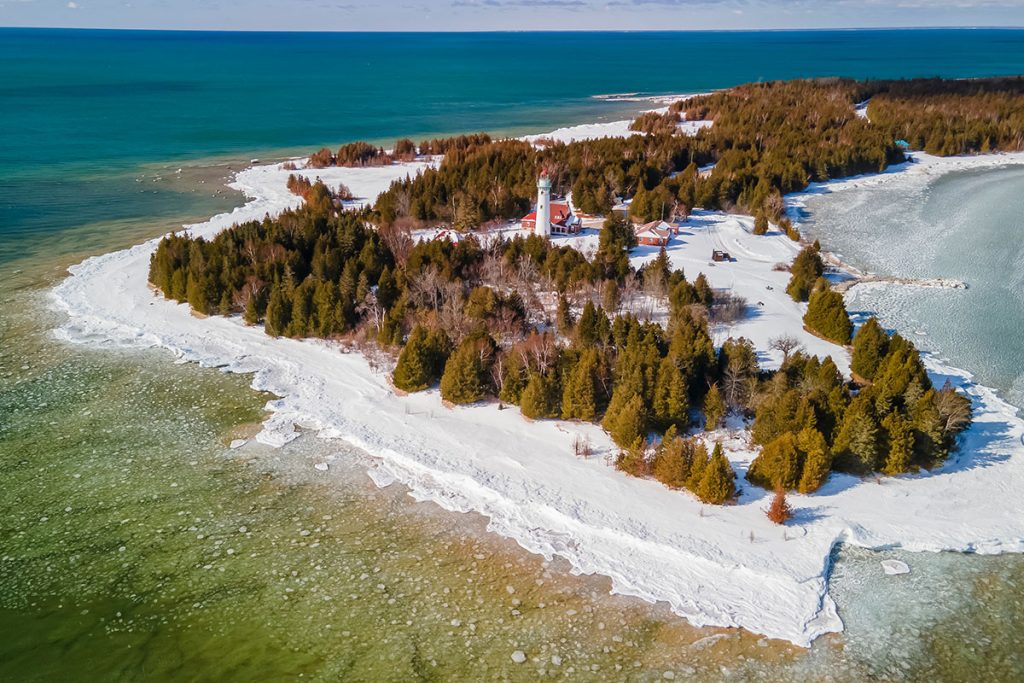 Aerial view of Seul Choix Pointe in Michigan upper peninsula with historic light house in the middle