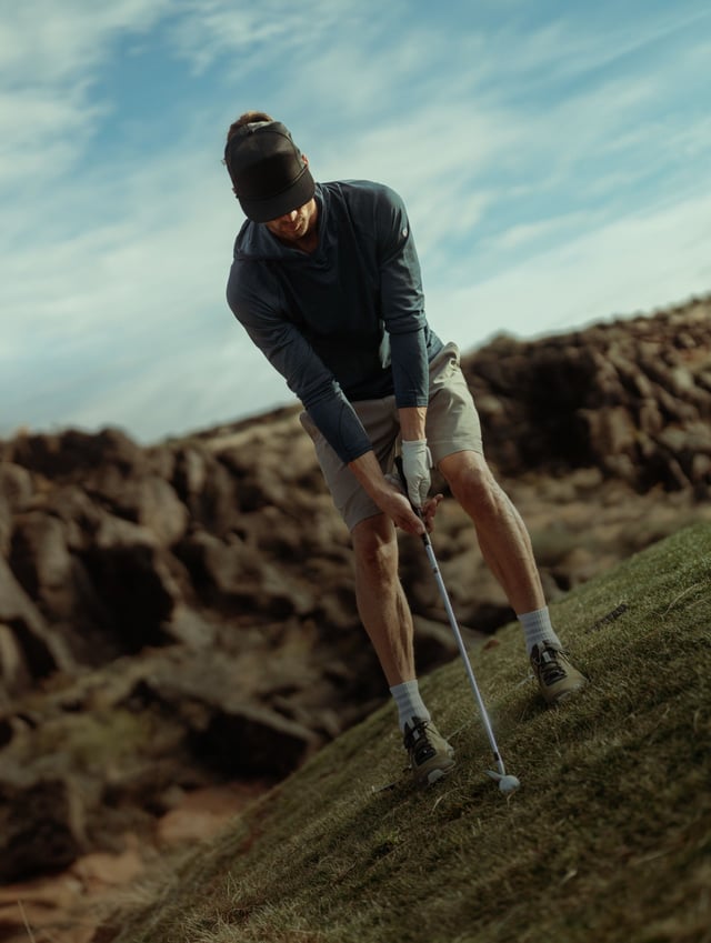Man wearing KUHL playing golf
