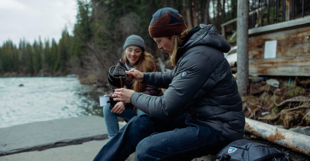 Man wearing crossfire hoody pouring coffee