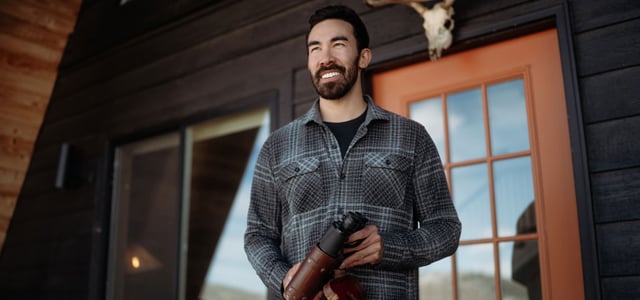 A man serving tea and wearing a Kühl Dillingr™ Flannel.