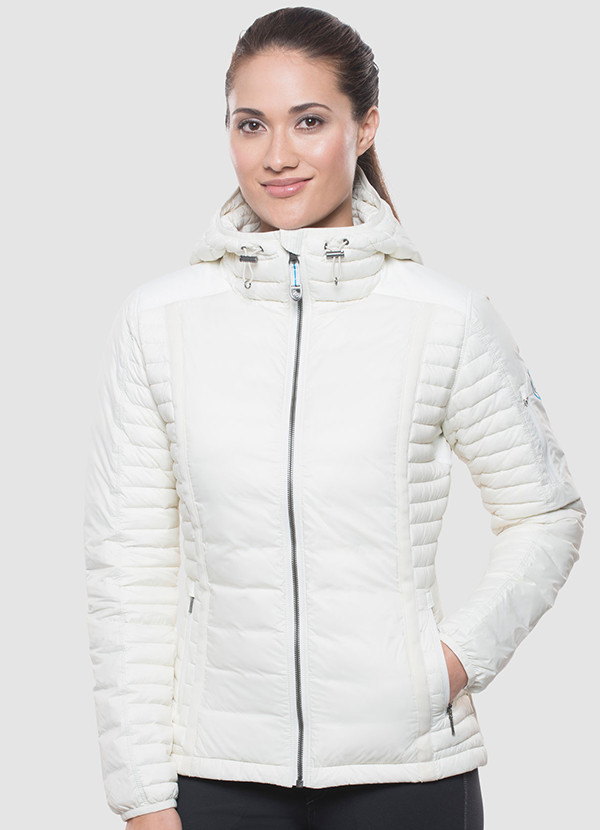 A studio photo of a woman wearing KUHL women's Spyfire Hoody in Ivory Color