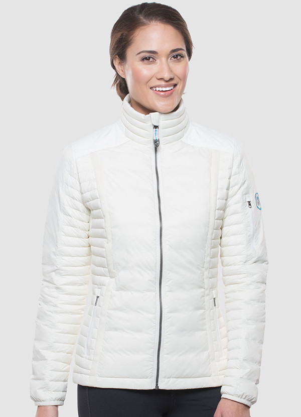 A studio photo of a woman wearing KUHL women's Spyfire Jacket in Ivory Color
